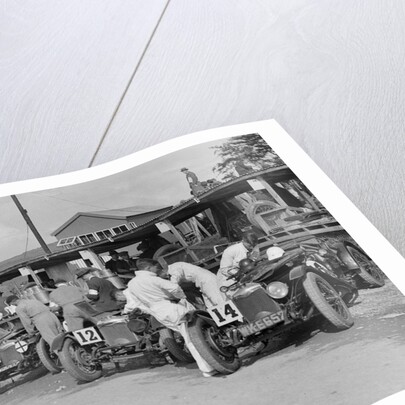 Triumph and Riley cars in the pits at the RAC TT Race, Ards Circuit, Belfast, 1929 by Bill Brunell