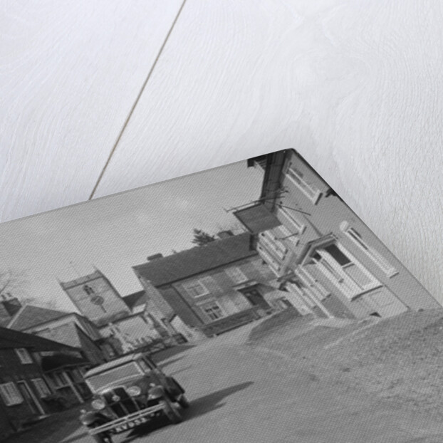 Standard Sixteen saloon driving down the High Street, Hambledon, Hampshire, 1930s by Bill Brunell