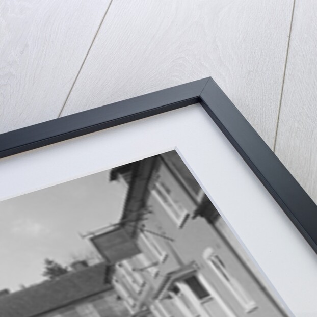 Standard Sixteen saloon driving down the High Street, Hambledon, Hampshire, 1930s by Bill Brunell