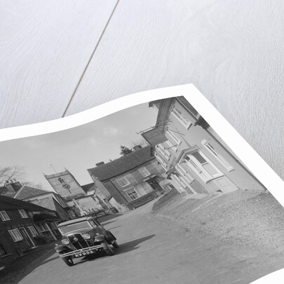 Standard Sixteen saloon driving down the High Street, Hambledon, Hampshire, 1930s by Bill Brunell