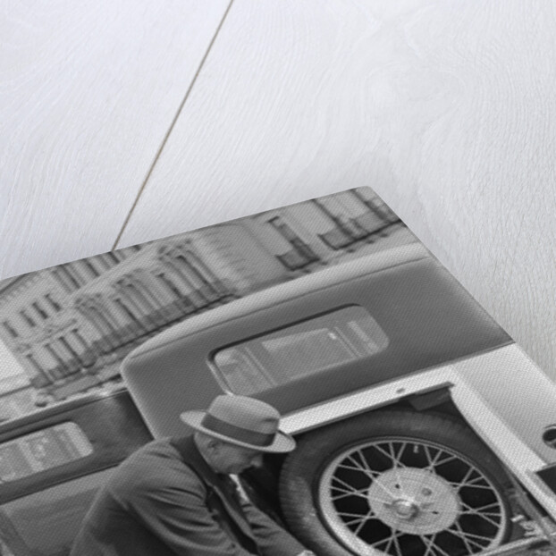 A driver opening the fitted toolkit of his Ford Model A at the Southport Rally, 1928 by Bill Brunell