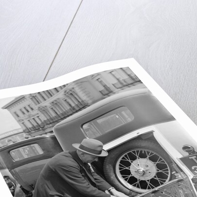 A driver opening the fitted toolkit of his Ford Model A at the Southport Rally, 1928 by Bill Brunell