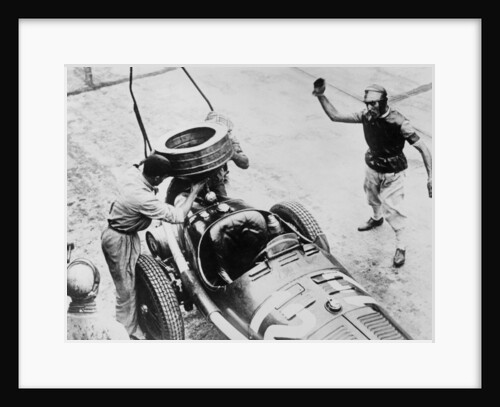 Tazio Nuvolari waiting for his car to be refuelled, c1930s(?) by Unknown
