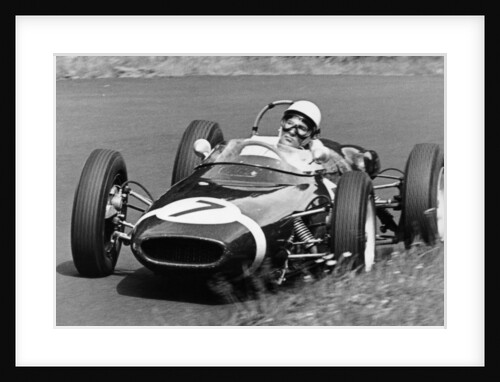 Stirling Moss taking a bend in a racing car, (c1960-c1961?) by Unknown