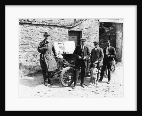 Bedford standing at the front of a car, with onlookers by Unknown