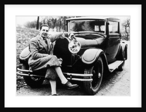 Jean Bugatti pictured with a Bugatti car by Anonymous
