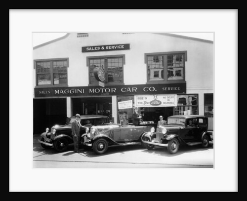 1932 Ford V8 in front of a car showroom, (c1932?) by Unknown