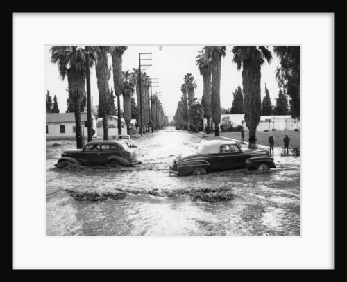 Cars on a flooded road in California, USA by Unknown