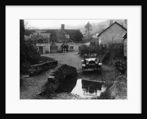 Kitty Brunell at the wheel of a Ford Model A by Anonymous