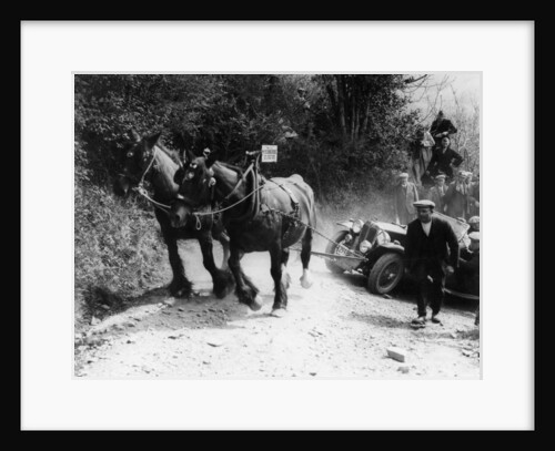 Horses pulling an MG up a hill by Anonymous