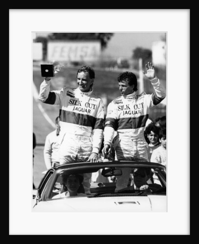 John Watson and Jan Lammers waving at the crowds at Jarama, Spain, 1987 by Unknown