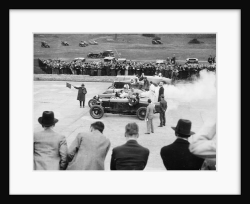Cars lined up for the start of a race by Anonymous