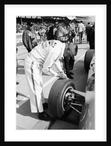 Technician checking tyre wear, Indianapolis, Indiana, USA, 1965 by Unknown