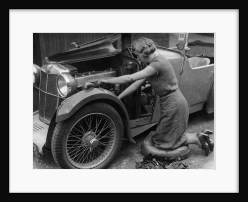 Kitty Brunell working on her MG F Magna by Unknown