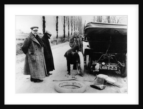 Lord Northcliffe's chauffeur changing a tyre, (c1908?) by Unknown