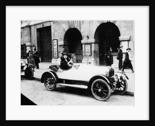 Miss Evelyn Laye sitting in a parked car, (1920s?) by Unknown