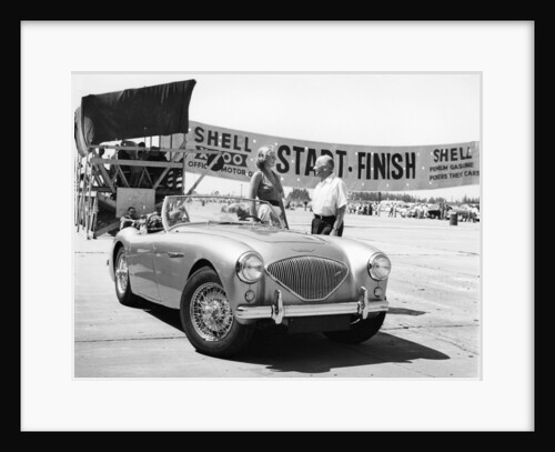 Donald Healey with an Austin Healey at a motor race by Unknown