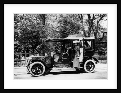 Woman stands by a 1907/8 Daimler by Unknown