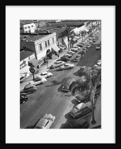 Street scene with cars parked, USA, c1952 by Unknown