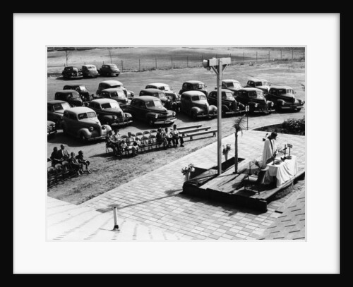 Outdoor church service with cars parked behind, USA, (1950s?) by Unknown