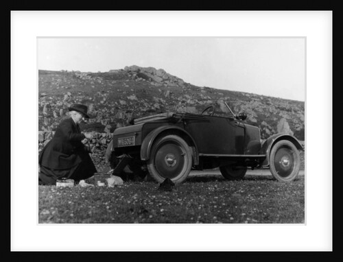 A woman picnicking next to her air-cooled Rover 8, c1919-c1925 by Unknown