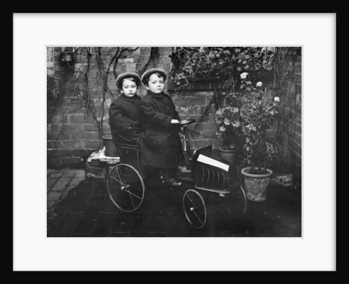 Two boys in a pedal car, (early 20th century?) by Unknown