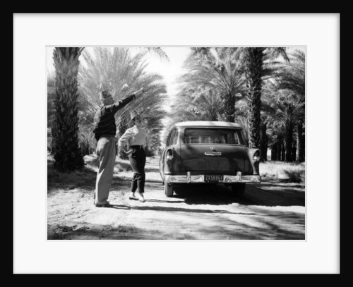Couple with a 1955 Chevrolet Townsman station wagon, (c1955?) by Unknown