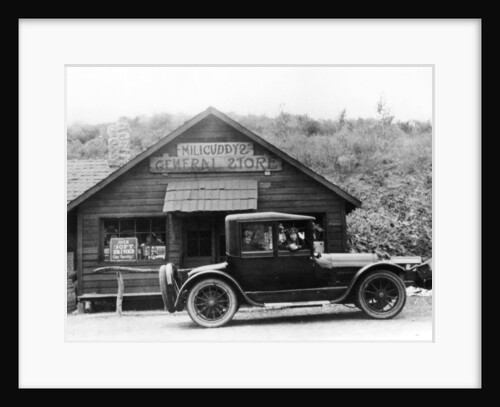 1916 Cadillac V8 car, parked outside a general store, USA by Anonymous