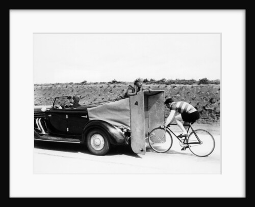 Cyclist training behind an Auburn car, c1935 by Unknown