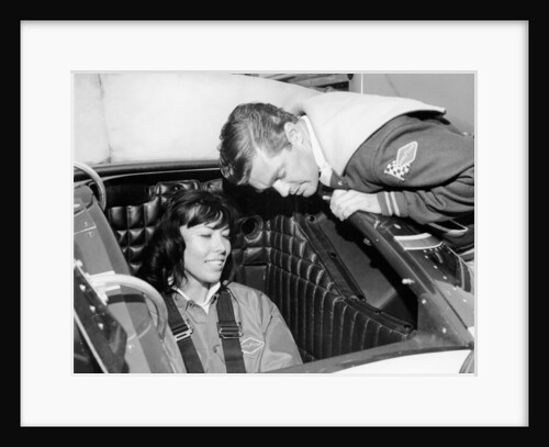 Craig Breedlove explaining the controls of 'Spirit of America Sonic I' to his wife, Lee, c1965 by Unknown