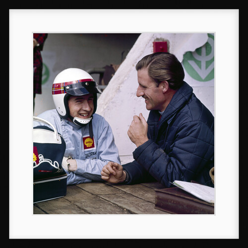 Jackie Stewart and Graham Hill chatting by Anonymous