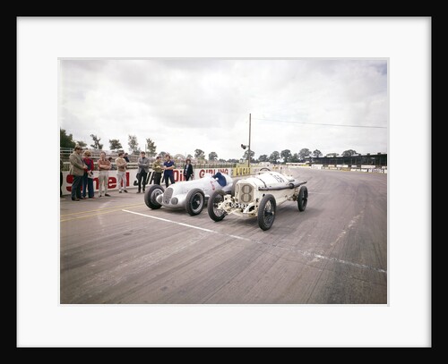 A 1914 and 1937 Grand Prix Mercedes racing cars at the starting line by Unknown