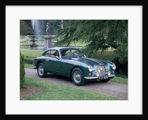 A 1952 Aston Martin DB2 saloon car photographed in a stately garden by Unknown