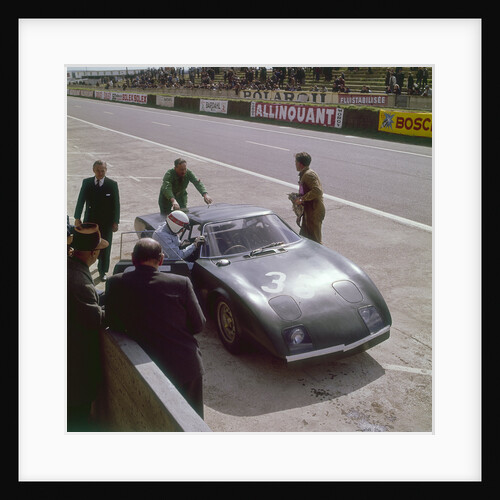 Jackie Stewart getting into a Rover BRM turbine by Anonymous