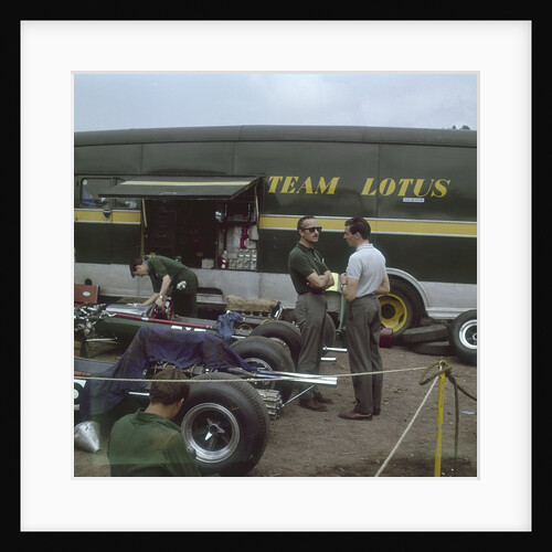 Chapman and Clark outside the Lotus team bus by Anonymous