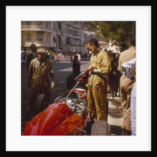 A Ferrari team member filling a car with fuel, Monaco Grand Prix, Monte Carlo, 1963 by Unknown