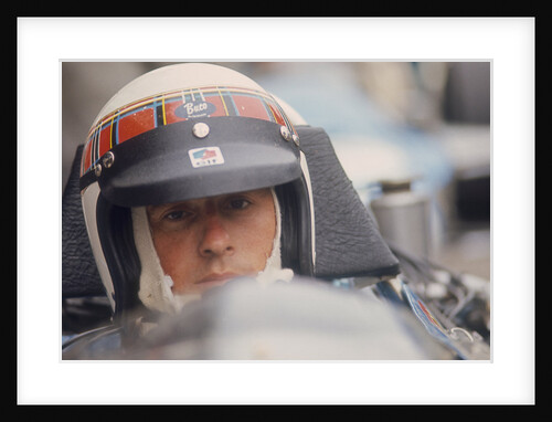 Jackie Stewart at the wheel of a racing car by Unknown