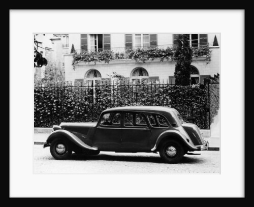 1954 Citroën 15CV Familiale parked outside a house by Unknown