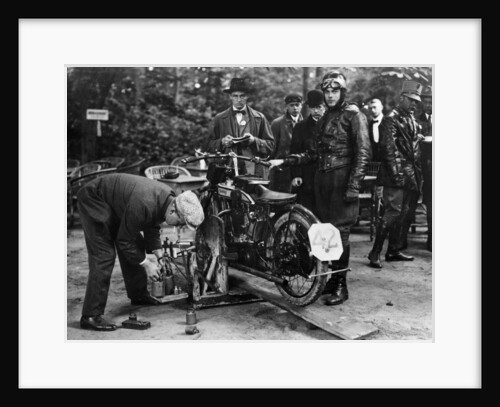 Karl Burlage having his Norton bike weighed for a TT competition by Unknown