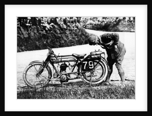 Norman Black repairing a punture on his Norton bike, 1920 by Unknown