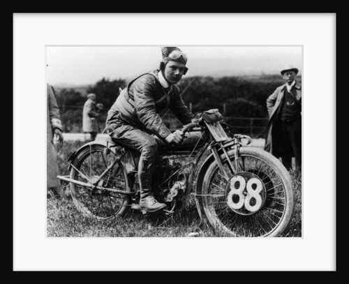 A man dressed in leathers on a Harley-Davidson by Unknown