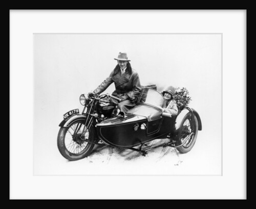 Man riding an AJS motorbike with a woman in the sidecar, 1939 by Unknown