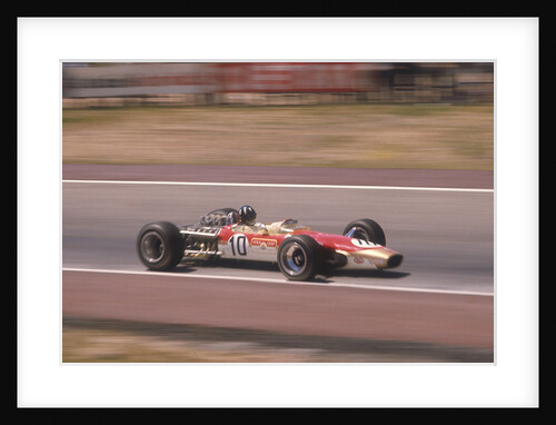 Graham Hill's Lotus at speed by Anonymous
