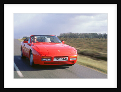 1990 Porsche 944 cabriolet driving along by Unknown