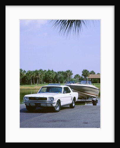 1967 Ford Mustang towing a boat by Unknown