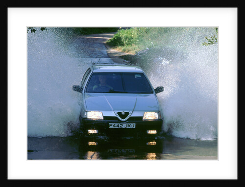 1989 Alfa Romeo 164 driving through a ford by Unknown