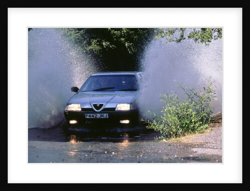 1989 Alfa Romeo 164 driving through a ford by Unknown