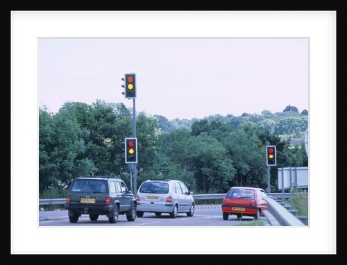 Traffic stopped at Traffic lights by Unknown