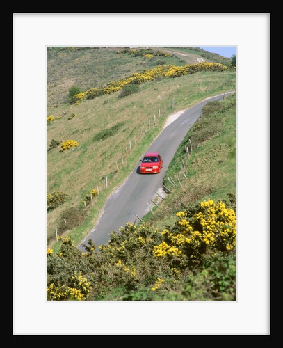 1996 Suzuki Baleno GS Sport on winding country lane,Dorset by Unknown