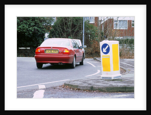 Keep left bollard.Road junction by Unknown